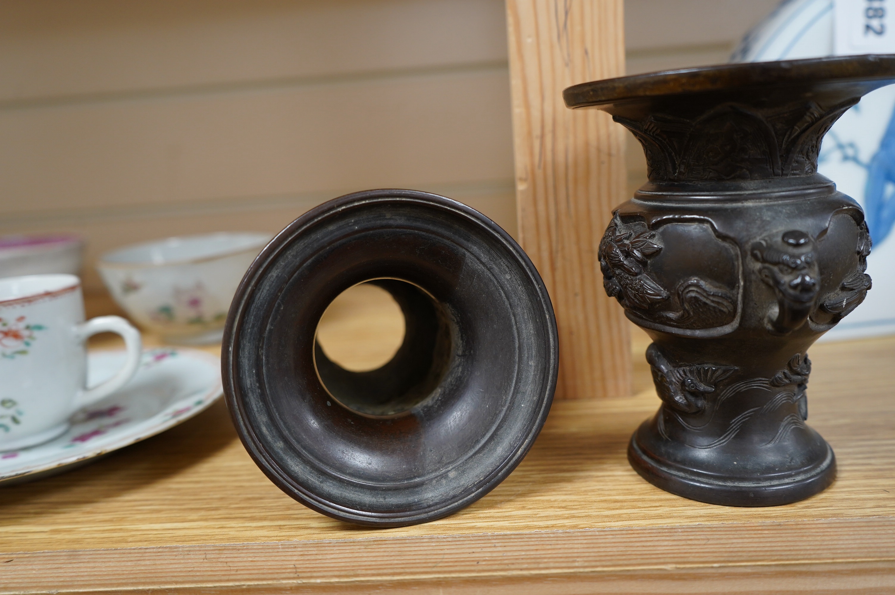 A pair of Japanese bronze vases, Meiji period, one signed, one lacking base, 13cm. Condition - fair